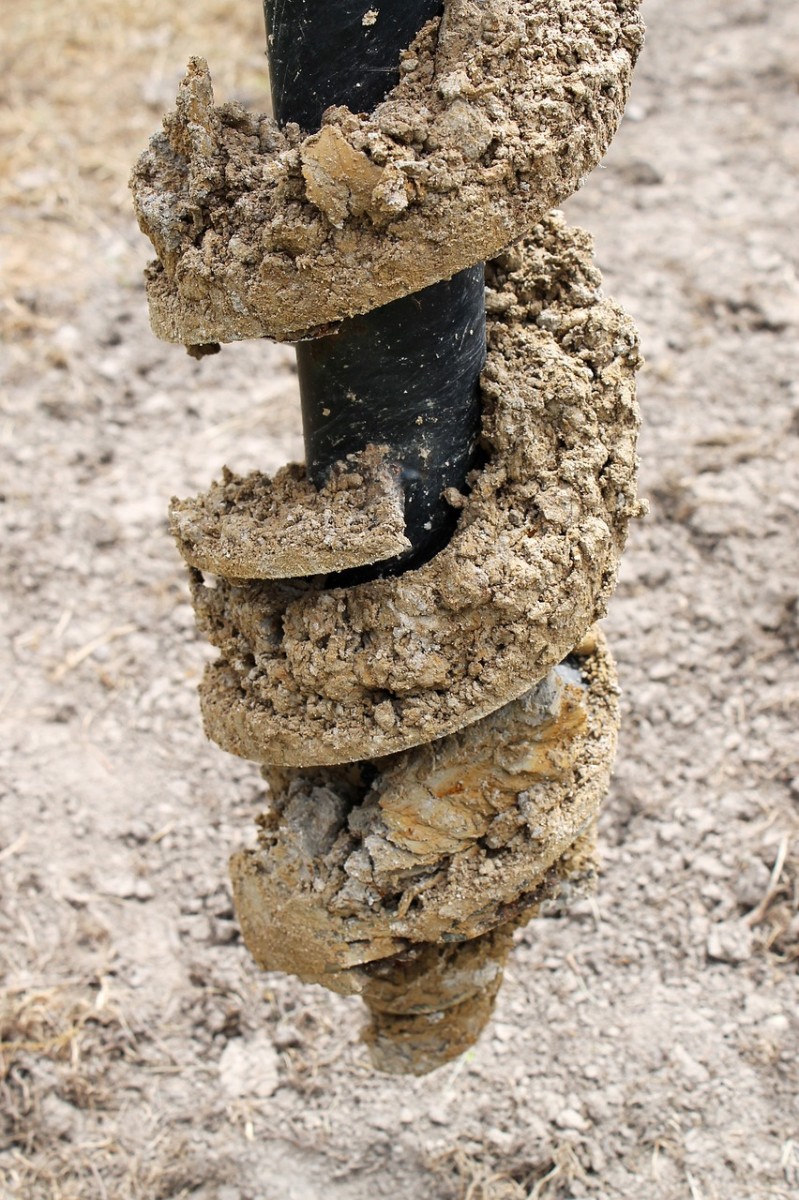 auger bit covered in dirt